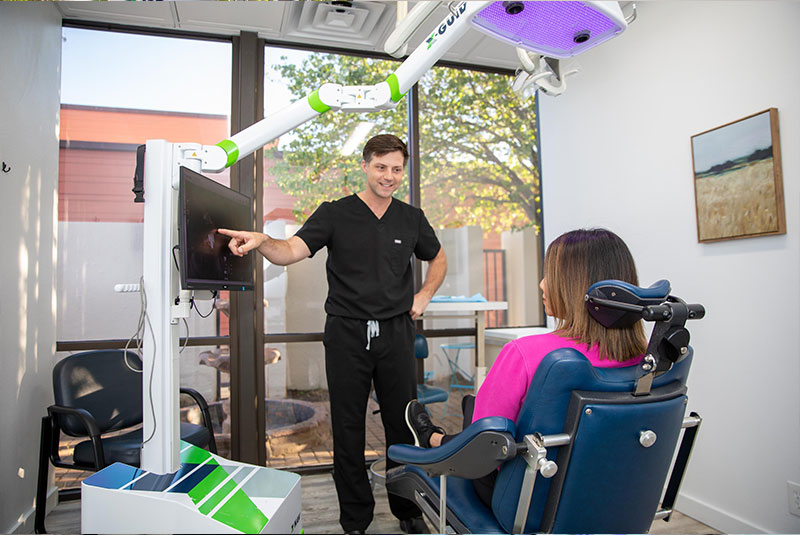 Doctor going over dental information with patient within the dental practice