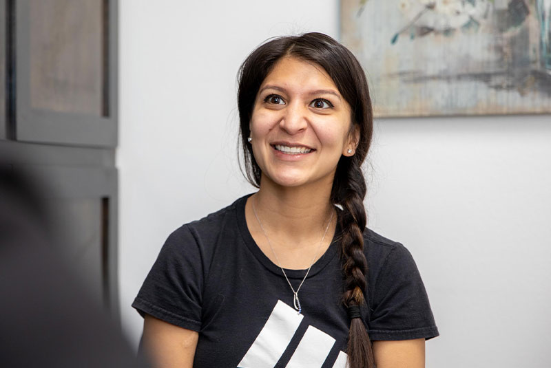 Patient smiling while going over dental information with doctor