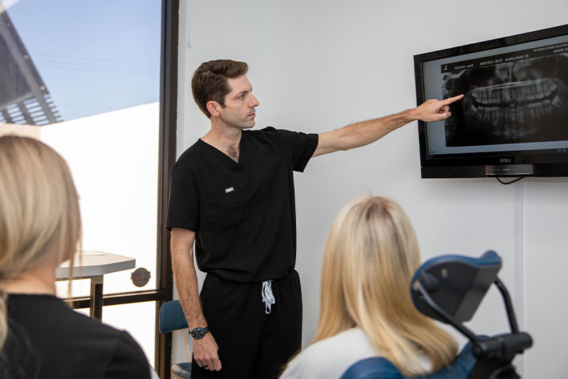 Dr. Montgomery showing dental implant prcoedure