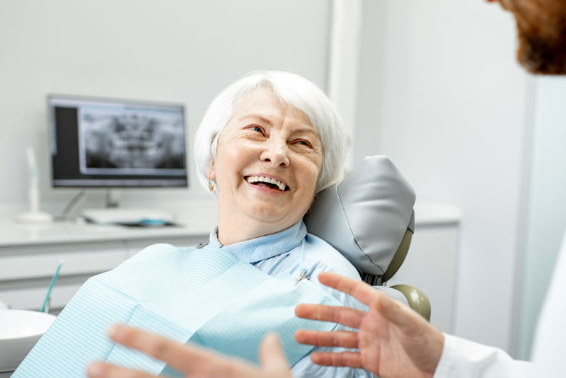 implant supported dentures patient smiling