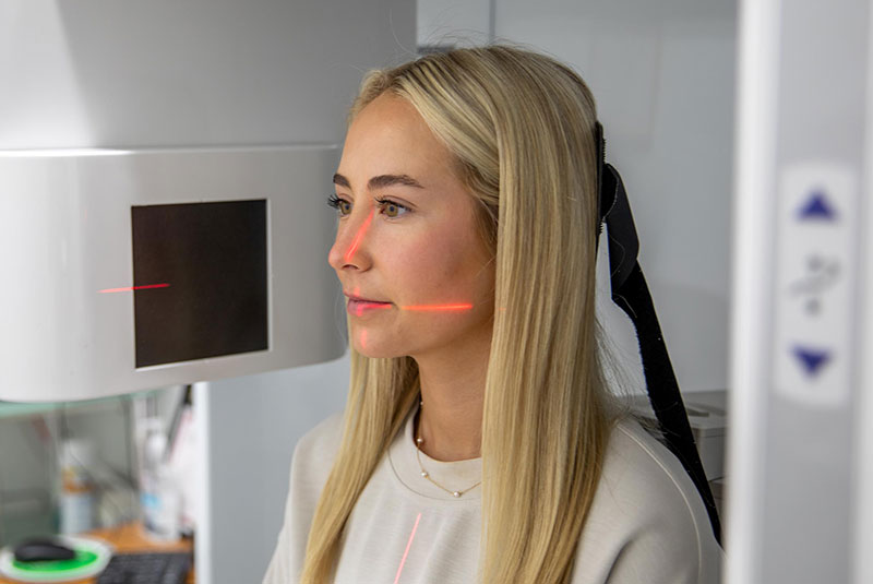 Patient within 3D scanning device for dental procedure