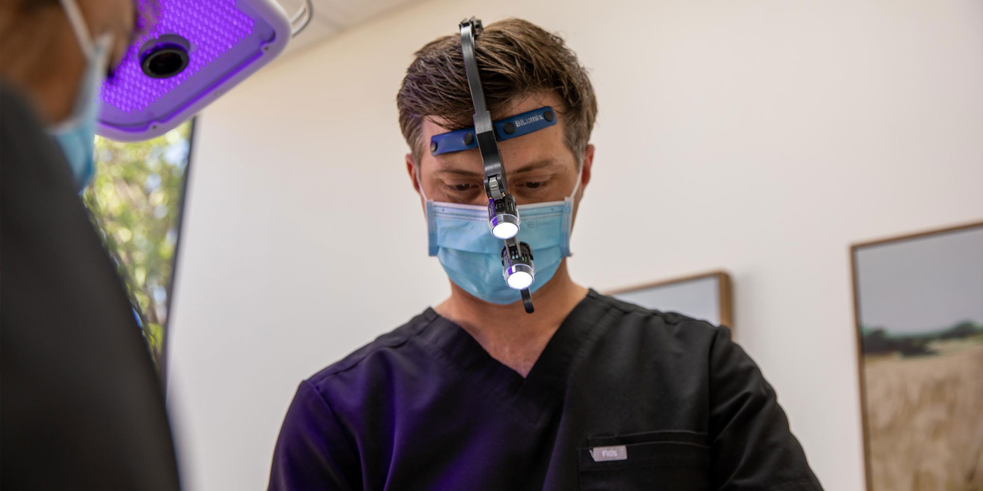 Doctor in the process of guided dental procedure